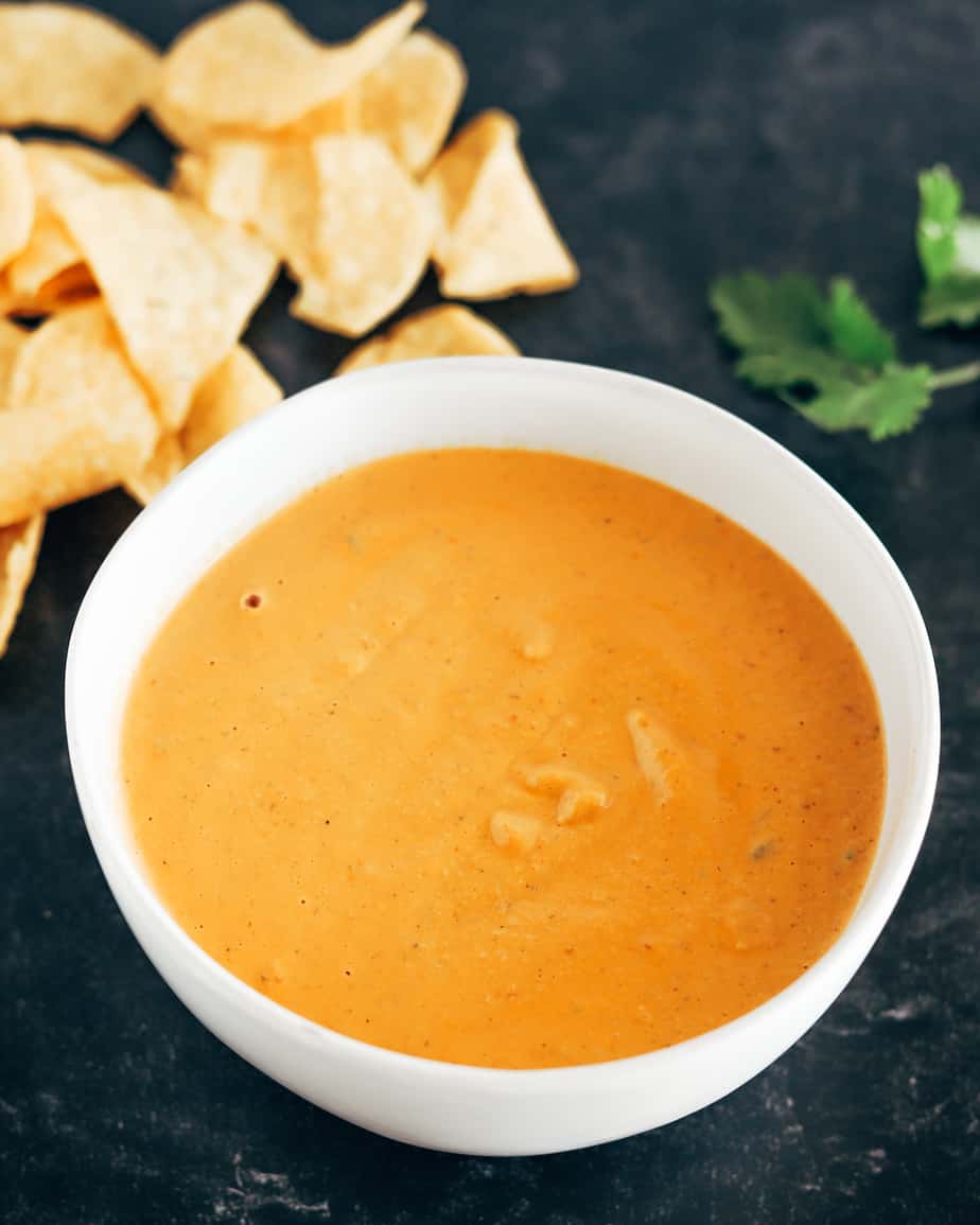 Vegan queso dip made with cashews and roasted tomatoes