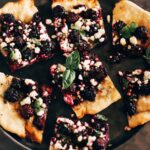 blackberry goat cheese flatbread with fresh basil leaves