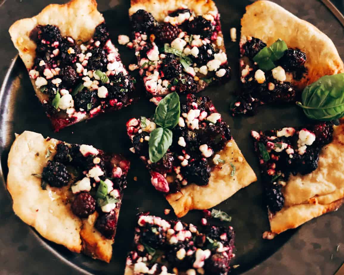 blackberry goat cheese flatbread with fresh basil leaves