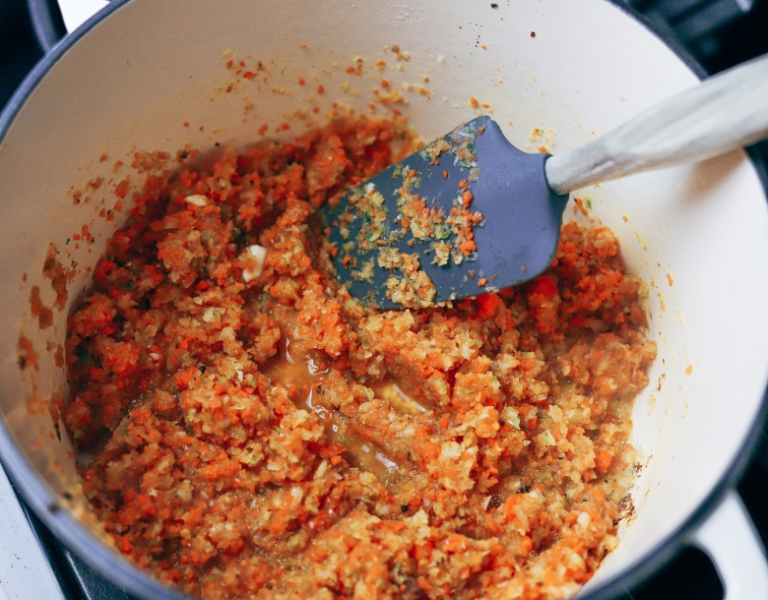 carrot onion and celery blend are sauteed in a Dutch oven