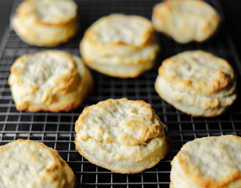freshly baked cream biscuits cooling on a wire rack