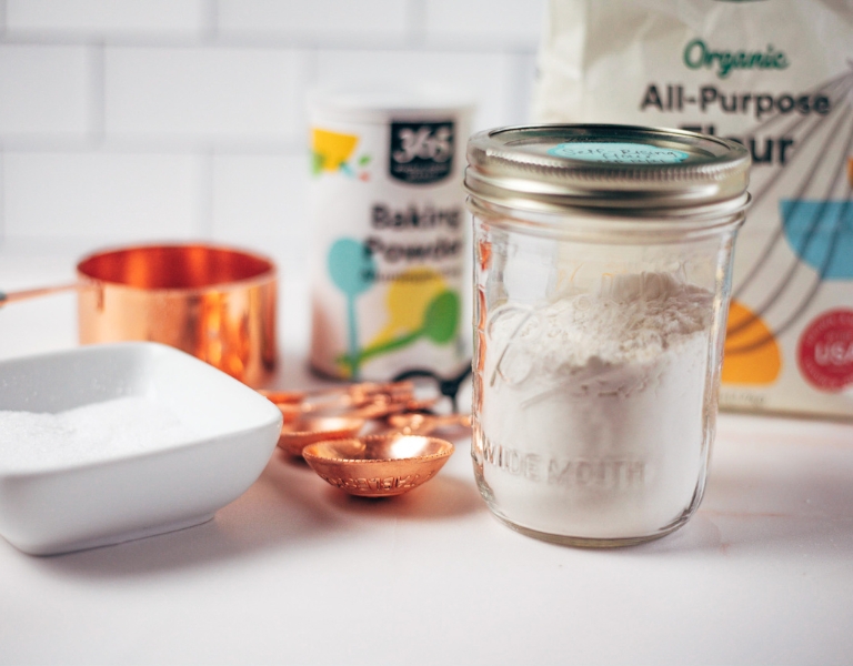 jar of self rising flour with the ingredients in the background